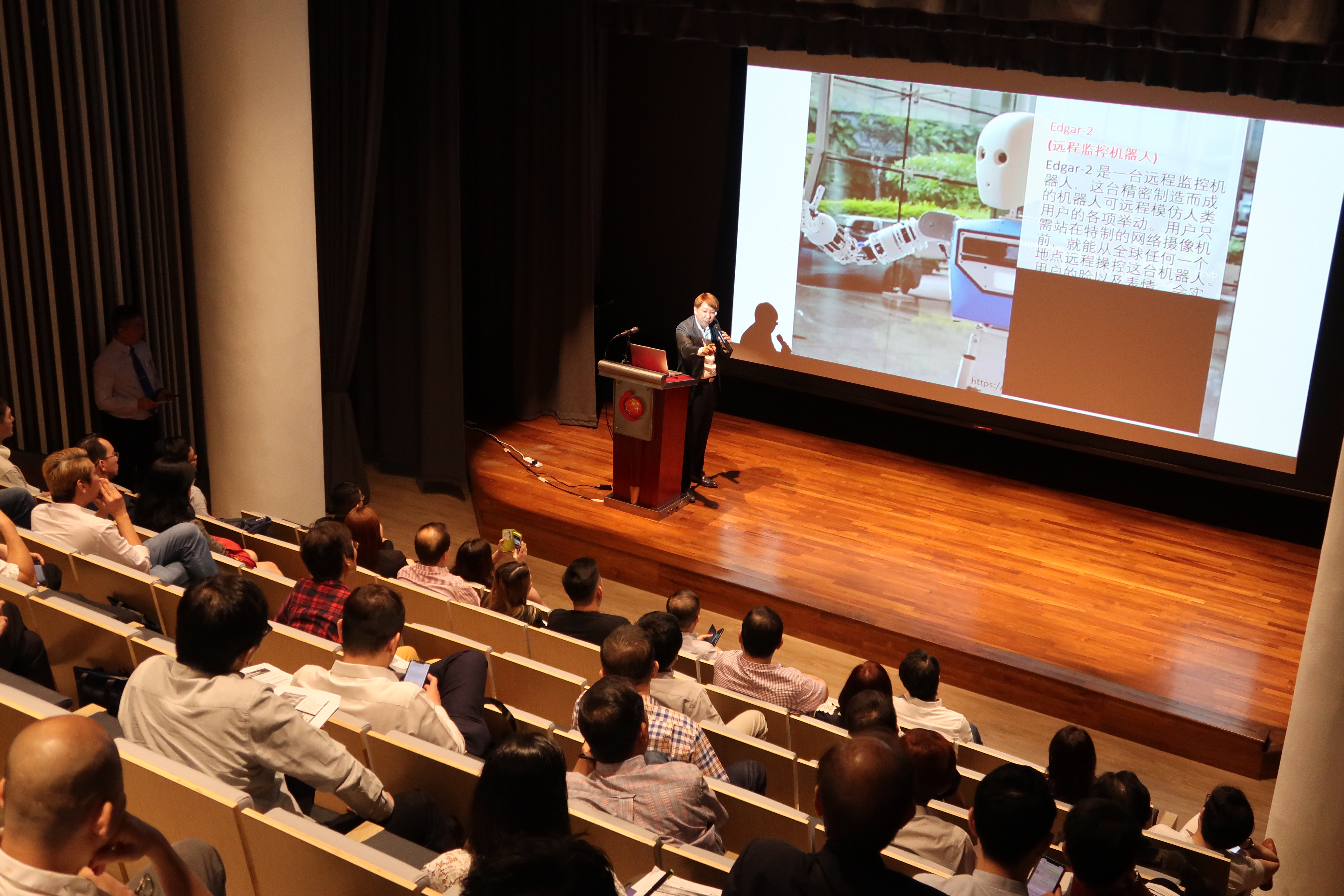 Addressing 100+ audienceship at the Singapore Chinese Chamber of Commerce
